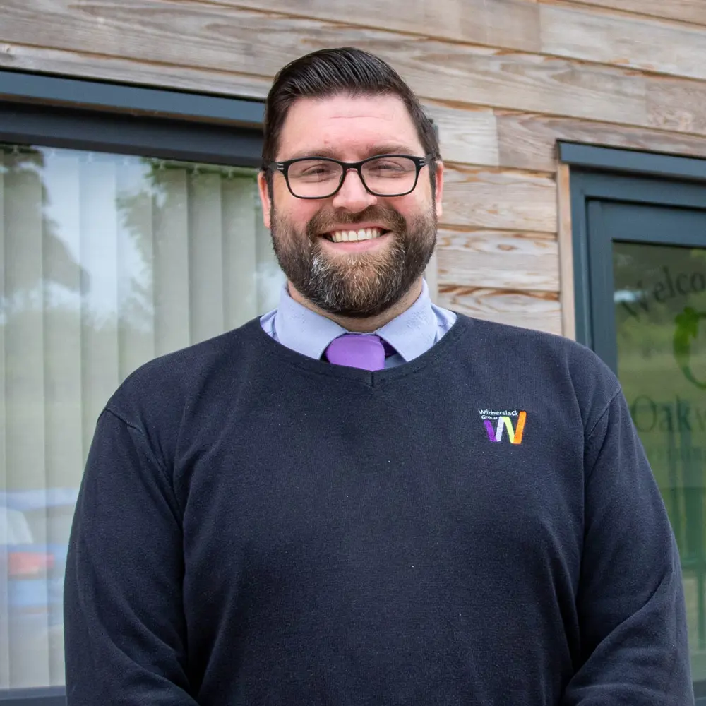 Headshot photo of Alister Sidgwick, headteacher of Oakwood Learning Centre smiling into the camera