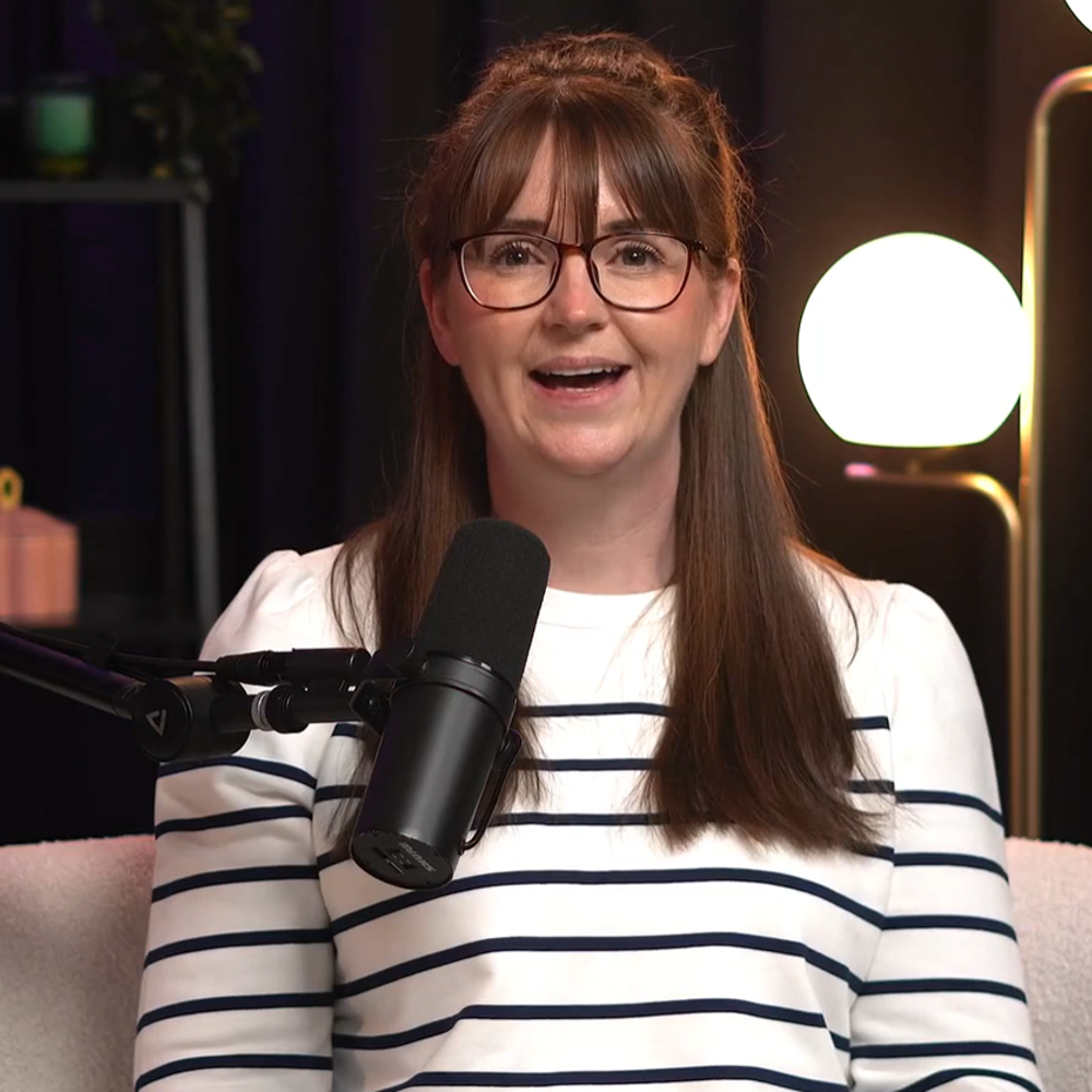 Image of Laura Oliver smiling at the camera in the SENsational podcast studio