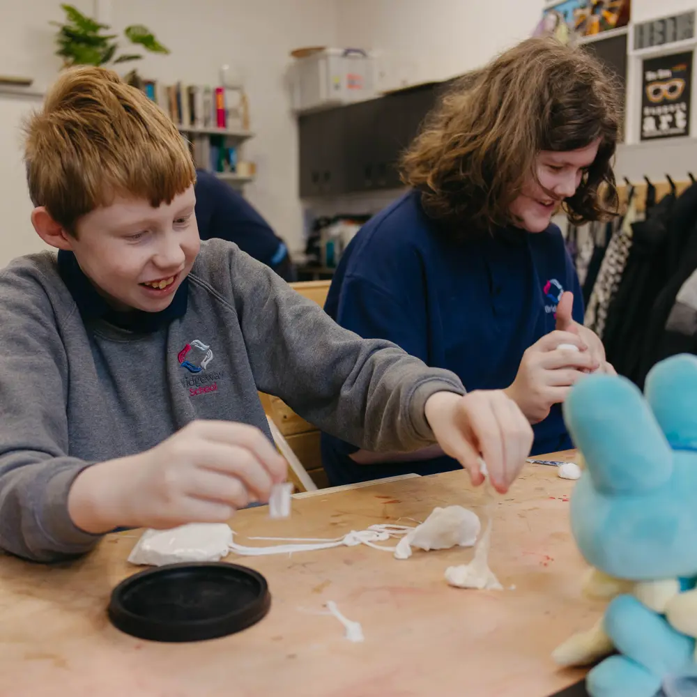 Two pupils at Bridgeway School using clay in a lesson