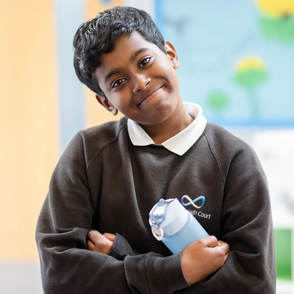 Boy from Luxborough Court School looking into camera and smiling